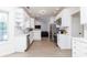 Well-lit kitchen featuring white cabinets, stainless steel appliances, and ample counter space at 3185 Perch Sw Dr, Marietta, GA 30008