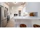 Spacious kitchen with stainless steel appliances, white cabinets, and an island with bar seating at 3185 Perch Sw Dr, Marietta, GA 30008