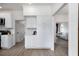 Charming kitchen with white cabinetry and access to a well-lit living area at 3185 Perch Sw Dr, Marietta, GA 30008