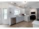 Bright kitchen featuring white cabinets, stainless steel appliances, and ample counter space at 3185 Perch Sw Dr, Marietta, GA 30008