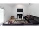 Bright living room featuring a fireplace, large sectional, and modern decor at 3185 Perch Sw Dr, Marietta, GA 30008
