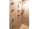 Modern shower with multiple showerheads and tile surround at 3185 Perch Sw Dr, Marietta, GA 30008
