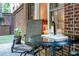 Inviting outdoor patio with a table and chairs, perfect for relaxation and al fresco dining at 3280 Stillhouse Se Ln # 108, Atlanta, GA 30339