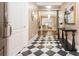 Welcoming foyer featuring a black and white checkered floor that leads into a bright and inviting living area at 3280 Stillhouse Se Ln # 108, Atlanta, GA 30339