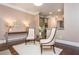 Sitting area with hardwood floors, two chairs, side table, and view of the kitchen at 3280 Stillhouse Se Ln # 108, Atlanta, GA 30339