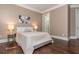 Comfortable main bedroom featuring soft lighting and a decorative, neutral color palette at 3280 Stillhouse Se Ln # 108, Atlanta, GA 30339