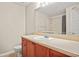 Clean bathroom featuring wood cabinets, a single sink and a shower and tub combo at 4248 River Green Nw Dr # 310, Atlanta, GA 30327