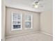 Bright bedroom with neutral carpet and a large window at 4248 River Green Nw Dr # 310, Atlanta, GA 30327
