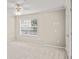 Bright bedroom featuring a ceiling fan, window and neutral walls at 4248 River Green Nw Dr # 310, Atlanta, GA 30327