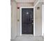 Exterior shot of front door with a traditional design and secure entry system at 4248 River Green Nw Dr # 310, Atlanta, GA 30327