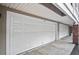 Multi-car garage doors on a single story house, featuring ample parking and convenient access at 4248 River Green Nw Dr # 310, Atlanta, GA 30327
