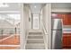 Hallway with carpeted stairs leading to an open second floor living space with hardwood floors at 4248 River Green Nw Dr # 310, Atlanta, GA 30327