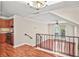 View of the staircase, living room and kitchen showcasing an open-concept home design at 4248 River Green Nw Dr # 310, Atlanta, GA 30327