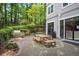 Cozy patio featuring a built-in grill, picnic table, and manicured landscaping, creating an inviting outdoor space at 4248 River Green Nw Dr # 310, Atlanta, GA 30327
