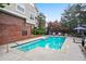 Community swimming pool with lounge chairs and landscaping, perfect for summer gatherings at 4248 River Green Nw Dr # 310, Atlanta, GA 30327