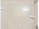 Brightly lit shower with white tile and a chrome shower head for a clean and fresh experience at 4248 River Green Nw Dr # 310, Atlanta, GA 30327