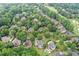 Aerial view of a neighborhood with lush greenery, showcasing the surrounding community and golf course at 7615 Laurel Oak Dr, Suwanee, GA 30024