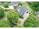 Aerial view of the home showcasing its large lot, mature trees, and driveway at 7615 Laurel Oak Dr, Suwanee, GA 30024