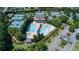 Aerial view showcasing the community amenities, including tennis courts and a swimming pool at 7615 Laurel Oak Dr, Suwanee, GA 30024