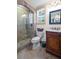 Bathroom with a glass-enclosed shower, vanity with a sink, and tile flooring at 7615 Laurel Oak Dr, Suwanee, GA 30024