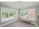 Comfortable bedroom features neutral tones and natural light from multiple windows at 7615 Laurel Oak Dr, Suwanee, GA 30024