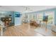 Large bonus room with wood floors, lots of light, built-in storage, and space for activities at 7615 Laurel Oak Dr, Suwanee, GA 30024