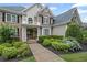 Close-up of a beautifully landscaped front exterior with well-maintained bushes and a welcoming entrance at 7615 Laurel Oak Dr, Suwanee, GA 30024