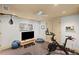 Bright home gym with weights, TV, peloton bike, and other exercise equipment at 7615 Laurel Oak Dr, Suwanee, GA 30024