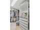 Organized walk-in closet featuring custom shelving, drawers, and ample space for clothing and accessories at 7615 Laurel Oak Dr, Suwanee, GA 30024