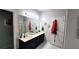 Bathroom features a double vanity with modern fixtures, a large mirror, and a glass-enclosed shower at 1245 Cedar Oak Ln, Lawrenceville, GA 30043