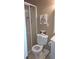 Bathroom features a toilet, shower, light fixtures, and decor at 1245 Cedar Oak Ln, Lawrenceville, GA 30043
