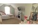 Bedroom features bed, window, a TV, a fireplace, decorations, and decor at 1245 Cedar Oak Ln, Lawrenceville, GA 30043