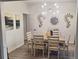 Dining room featuring a modern light fixture and ample seating for six at 1245 Cedar Oak Ln, Lawrenceville, GA 30043