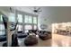 Bright and airy living room featuring high ceilings, a fireplace, and an open layout leading to the kitchen at 1245 Cedar Oak Ln, Lawrenceville, GA 30043