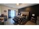 Bright main bedroom with a black accent wall and modern furnishings at 1245 Cedar Oak Ln, Lawrenceville, GA 30043