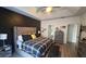 Spacious main bedroom with a vaulted ceiling and a modern accent wall at 1245 Cedar Oak Ln, Lawrenceville, GA 30043