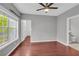 Spacious bedroom features hardwood floors and views of an ensuite bathroom at 1250 Parkwood Se Cir # 1213, Atlanta, GA 30339