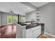Modern kitchen with stainless appliances and granite counters, blending into the open-concept living area at 1250 Parkwood Se Cir # 1213, Atlanta, GA 30339