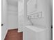 This laundry area features a stacked washer and dryer with wire shelving for additional storage at 1250 Parkwood Se Cir # 1213, Atlanta, GA 30339