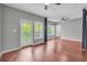 Living room featuring hardwood floors and access to a balcony through glass doors at 1250 Parkwood Se Cir # 1213, Atlanta, GA 30339
