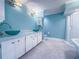 Bathroom with dual vessel sinks, modern lighting, vanity, and a glass-enclosed shower at 3836 Loch Highland Ne Pkwy, Roswell, GA 30075