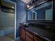Bathroom showcasing a modern sink, black countertops and accents, and an adjacent bathtub at 3836 Loch Highland Ne Pkwy, Roswell, GA 30075