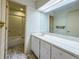 Bright bathroom featuring a vanity with a wide mirror, and a shower-tub combination at 3836 Loch Highland Ne Pkwy, Roswell, GA 30075