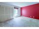 Bedroom with neutral carpet, large closet, and window providing natural light at 3836 Loch Highland Ne Pkwy, Roswell, GA 30075