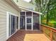 View of the screened in porch, offering a serene outdoor space for relaxation and entertaining at 3836 Loch Highland Ne Pkwy, Roswell, GA 30075