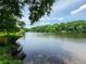 Scenic waterfront view overlooking peaceful waters and lush greenery at 3836 Loch Highland Ne Pkwy, Roswell, GA 30075