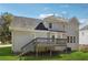 Exterior of home features a deck, stairs, and fenced yard at 4271 Weston Sw Dr, Lilburn, GA 30047