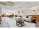 Digitally staged basement with laminate flooring, wainscoting, furniture, and decor at 4271 Weston Sw Dr, Lilburn, GA 30047