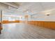 Basement with laminate flooring, wainscoting, and multiple windows at 4271 Weston Sw Dr, Lilburn, GA 30047