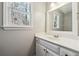 Bright bathroom with a large mirror and vanity with storage at 4271 Weston Sw Dr, Lilburn, GA 30047